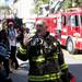 A firefighter gestures at the scene of a fire at 611 Church Street on Monday. Daniel Brenner I AnnArbor.com